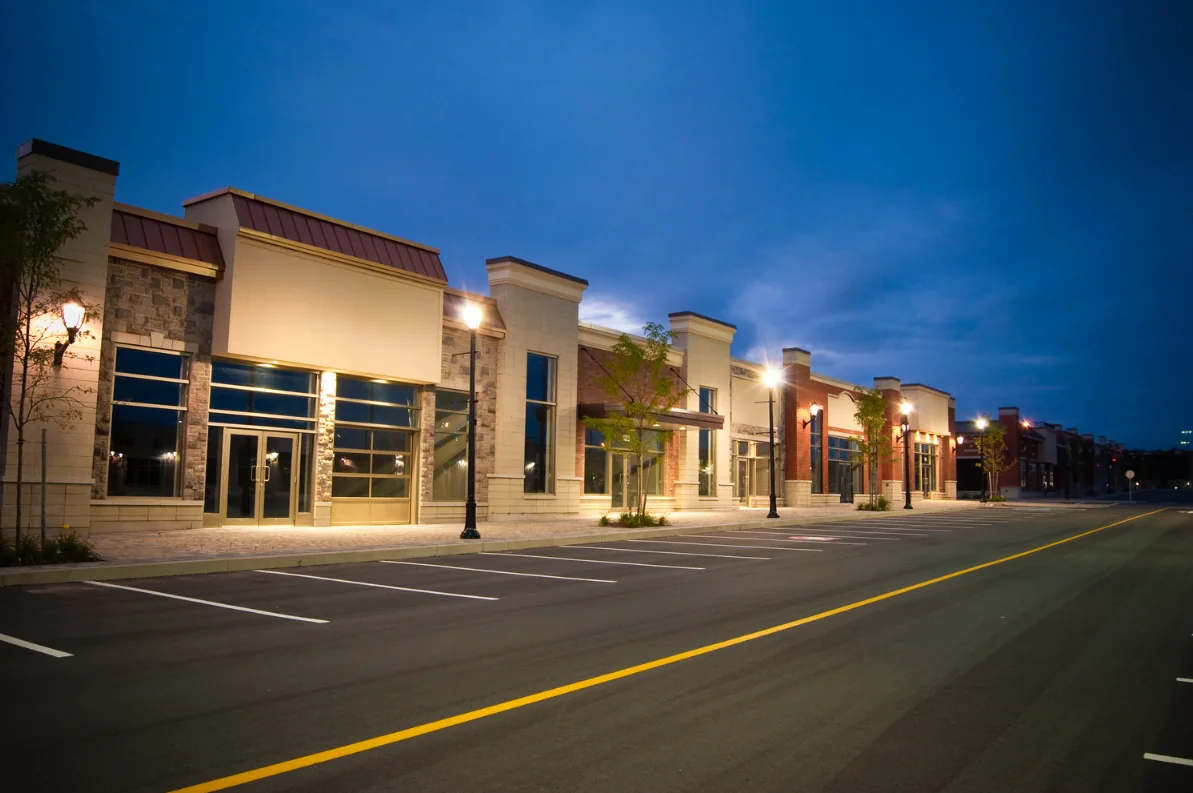 Multi-tenant strip center with lit storefronts in Middle Tennessee